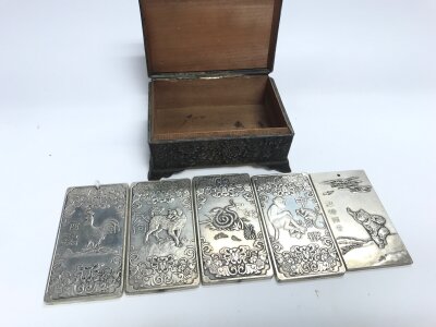 Five Chinese Tibetan silver embossed amulets