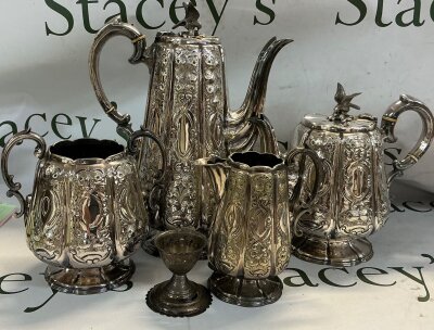 A silver plated tea set that consists of a: hot water pot, teapot, lidded sugar bowl, milk jug and small goblet. Dimensions between 5cm-25cm