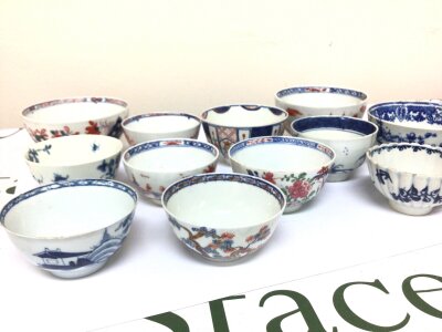 A collection of Worcester and other English 18th century tea bowls decorated in the Imari style and blue and white tea bowls in the Chinese Style.