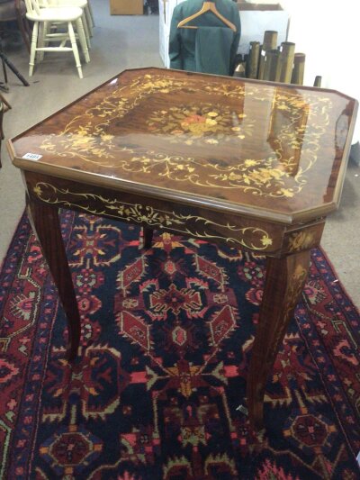 A quality Italian 20th century marquetry walnut Games table the detachable top above games board and roulette wheel with accessories. Height 75cm width 78cm