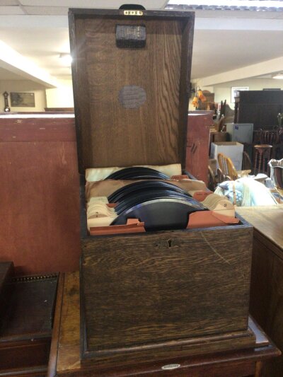 A Vintage oak Record cabinet complete with a range of indexed 78 HMV and other records