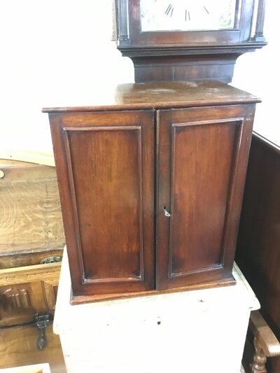 An oak collector's cabinet.