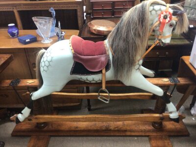 A quality Vintage Rocking horse painted in dapple grey colours with horse tail and mane on a traditional beechwood and metal safety rocker. 
Height 116cm