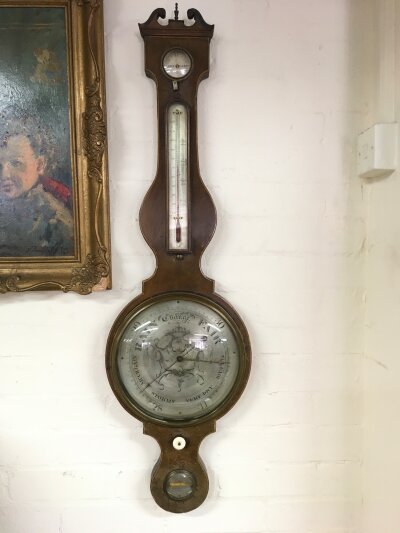 A 19th Century mahogany wall barometer, approx 106cm.