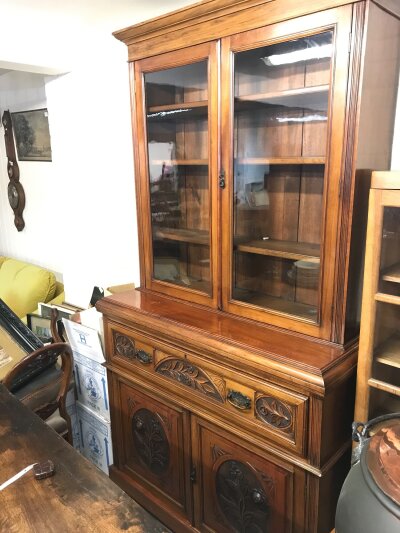 A walnut secretaire bookcase with carved floral design. 221cm tall. 51cm deep, 122cm wide