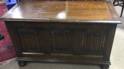 A blanket box, chest of draws and a cabinet made from oak.