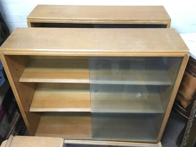 A pair of teak glazed bookcases, approx 91cm x 84cm x 25cm.