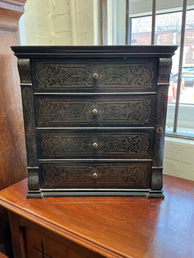 A 19thC miniature boulle style inlaid chest.
