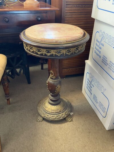 A small marble topped gilt mounted french wine table.
