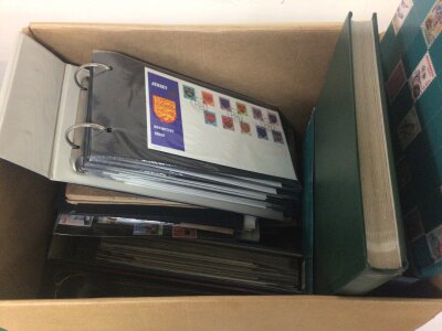 A box containing loose stamps albums of unused British Pictorial Elizabeth II stamps and others