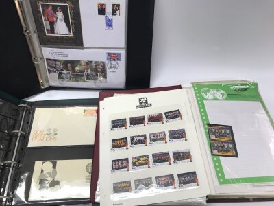 A collection of 11 stamp and first day cover albums and some coin covers