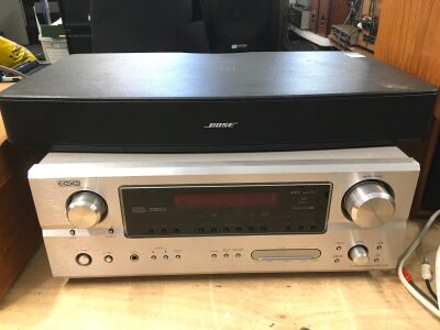 A Denon AVR-2106 receiver and a Bose unit (2).