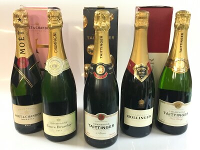 Five bottles of champagne including Moët & Chandon, Veuve Devanlay, Tattinger