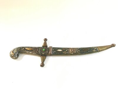 A well decorated possibly Indian knife with brass decoration. 32cm long total length