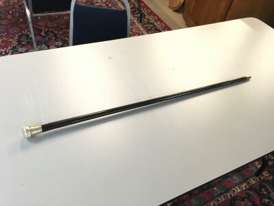 An ebonzied silver top sword stick. Blade 32cm long . Total length 92cm long