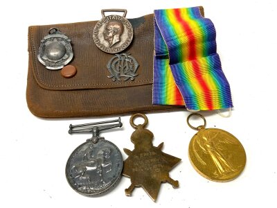 A WW1 medal group awarded to G.A BORE. K.23679, STO.1.R&N, Bronze Italian medal, uninscribed medallion, silver mounted leather purse.