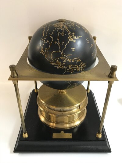 A Royal Geographical society world clock, 28cm tall , 22cm long, 22cm wide