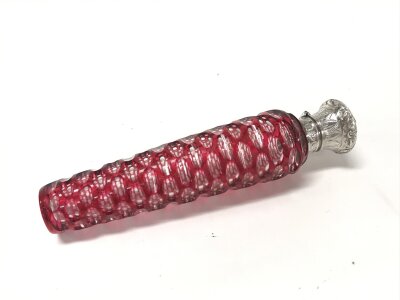 Victorian tapering cylindrical red overlaid glass scent bottle with hinged unmarked white metal top, with stopper. W3cm D3cm H12cm
