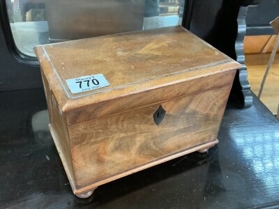A small mahogany veneered tea caddy with 2 compartments.
