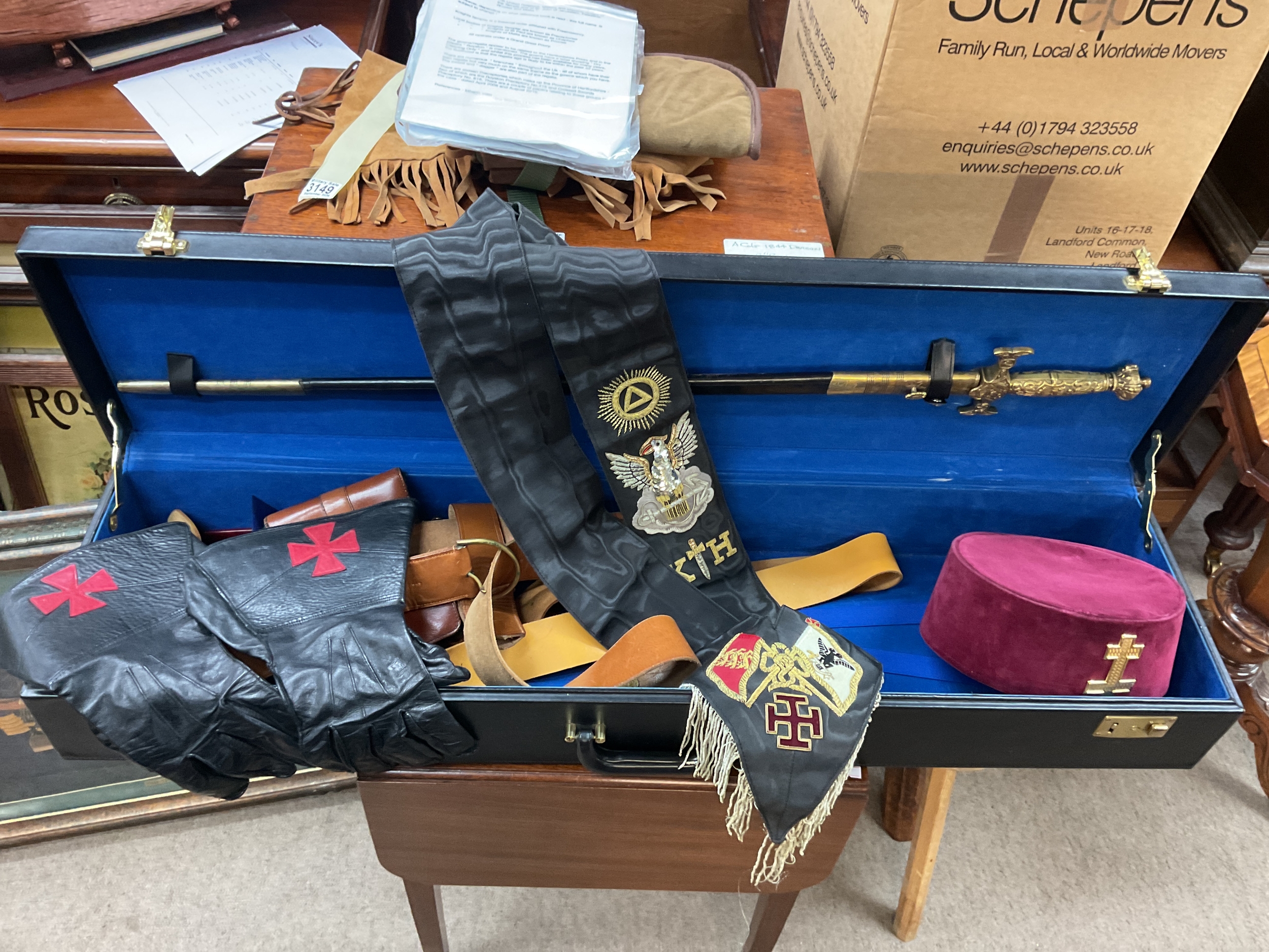 Cased Masonic Knights Templar sword,gloves,belts and hat, along with historical research.