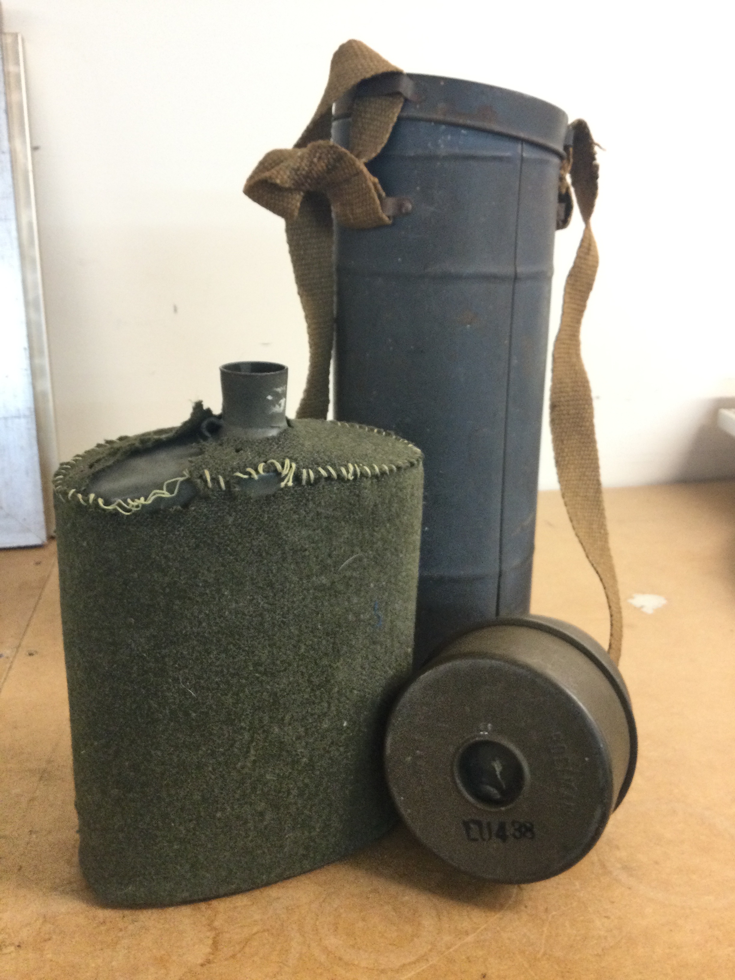 A British WW2 water bottle and a Poelman gas mask air filter  