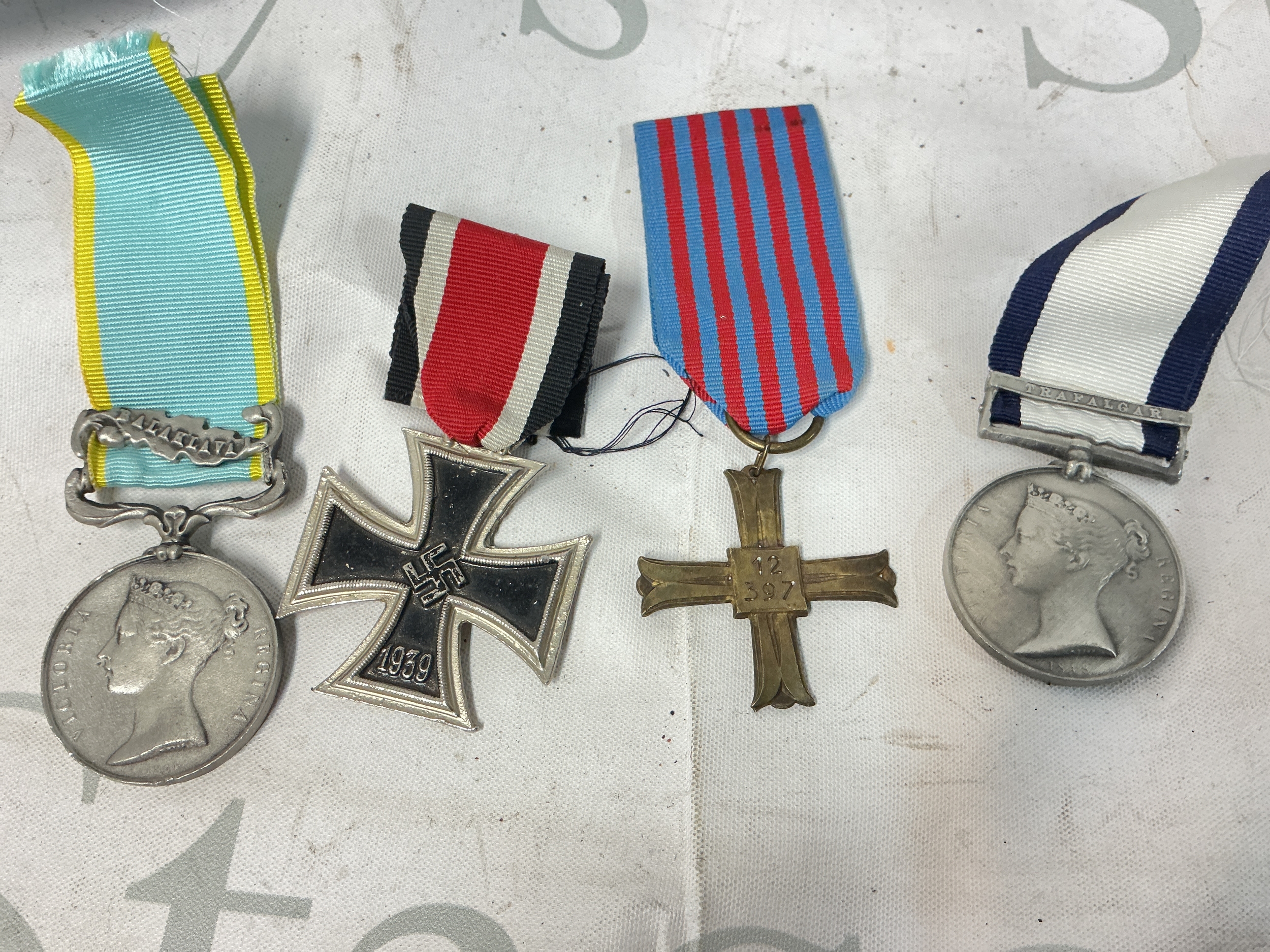 A Mixed Assortment Of 4 Repro Medals.