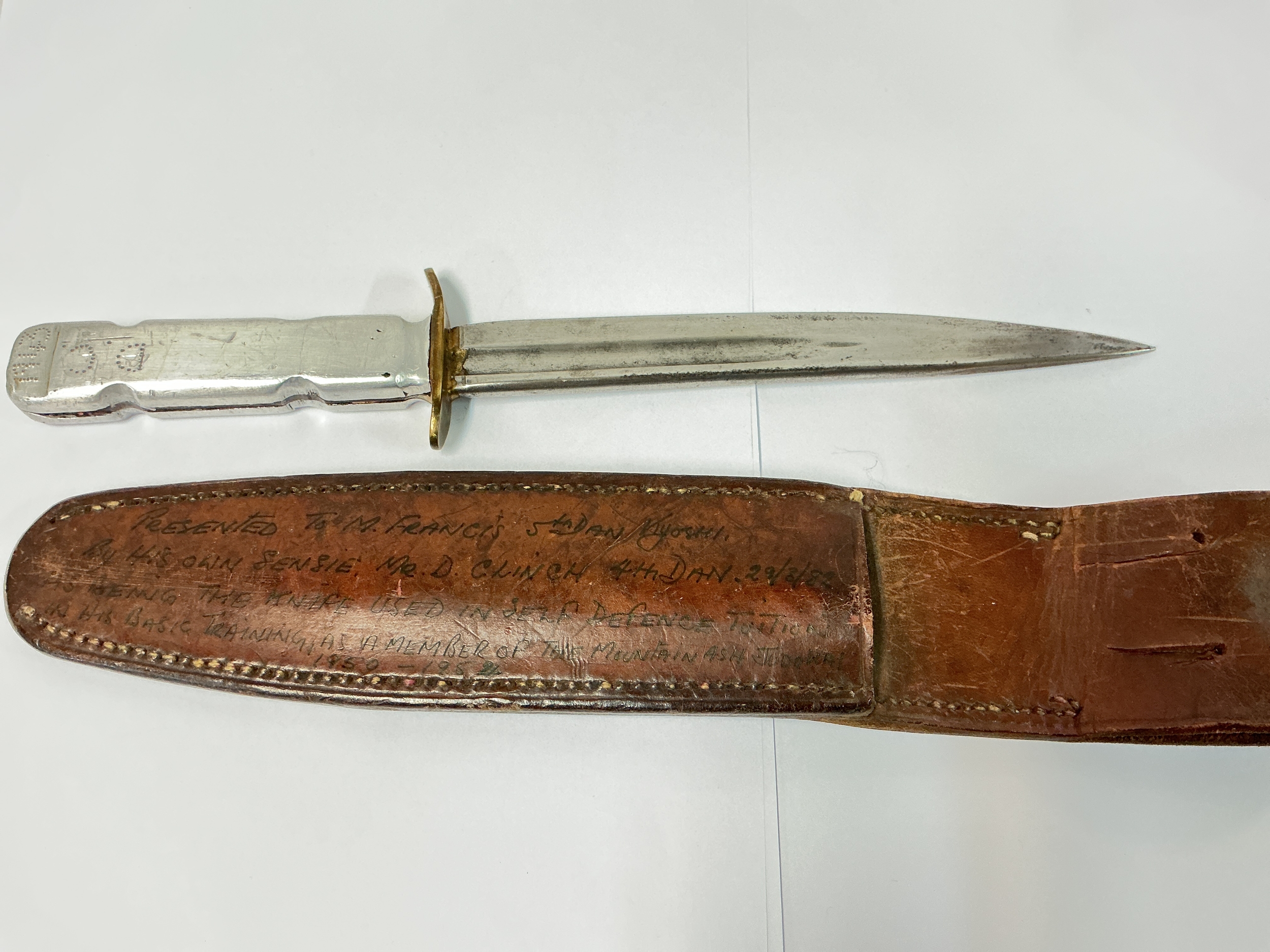 A WW2 Combat Knife Dated 1943 And Initialled on Its Scabbard.