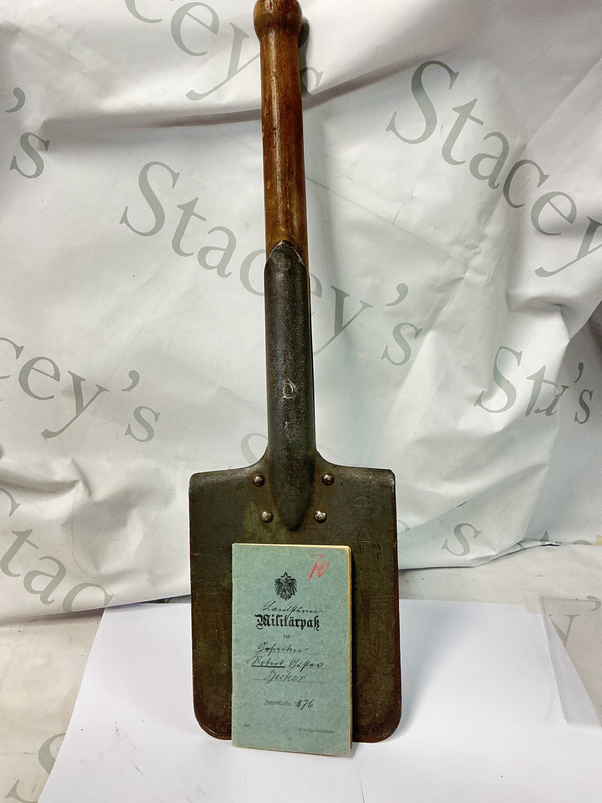 A WW1 German Entrenching Tool Maker Marked With WW1 German Service Book Dated. (2).