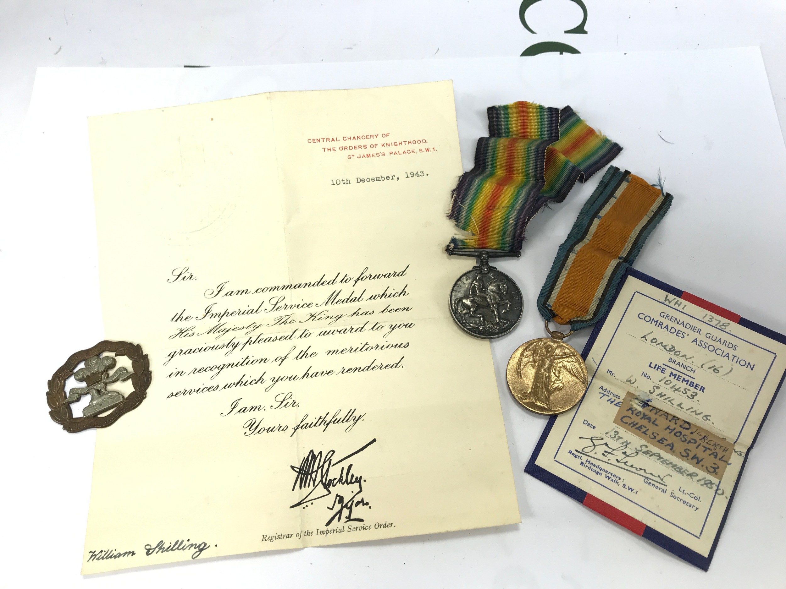 A WW1 pair of medals presented to SE-19557 PTE.D HAGON A.V.C , SL POWS vol cap badge and two papers