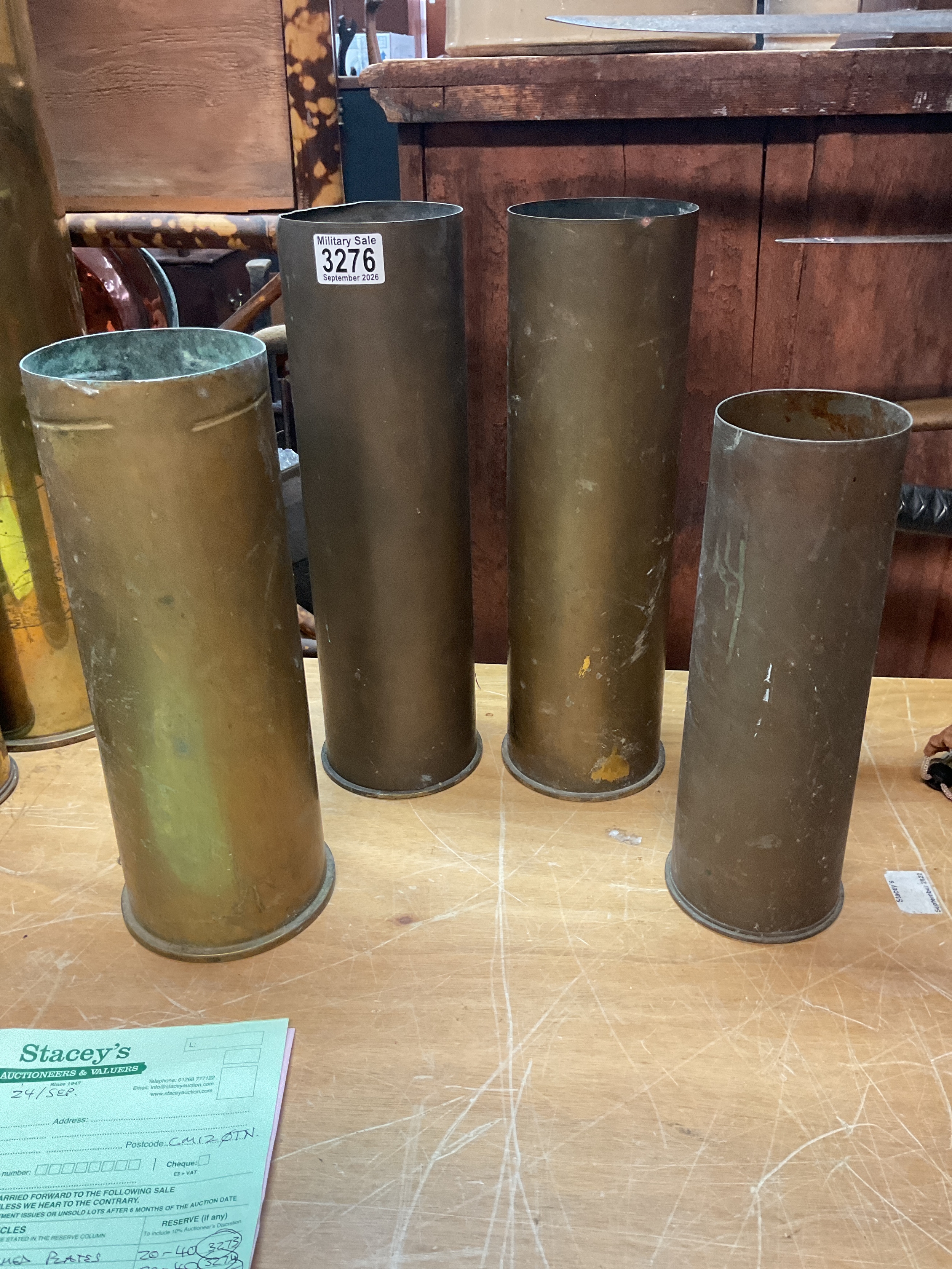 Four artillery shells, 105 etc.