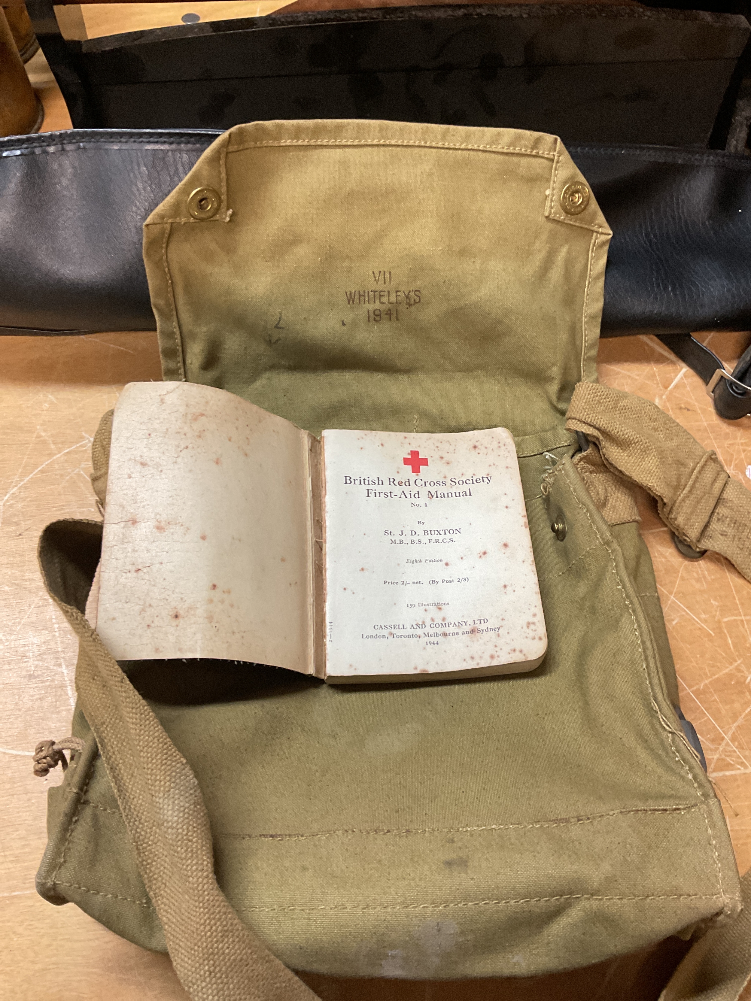 WWII 1941 Whiteleys stamped bag, with 1944 Red Cross manual.