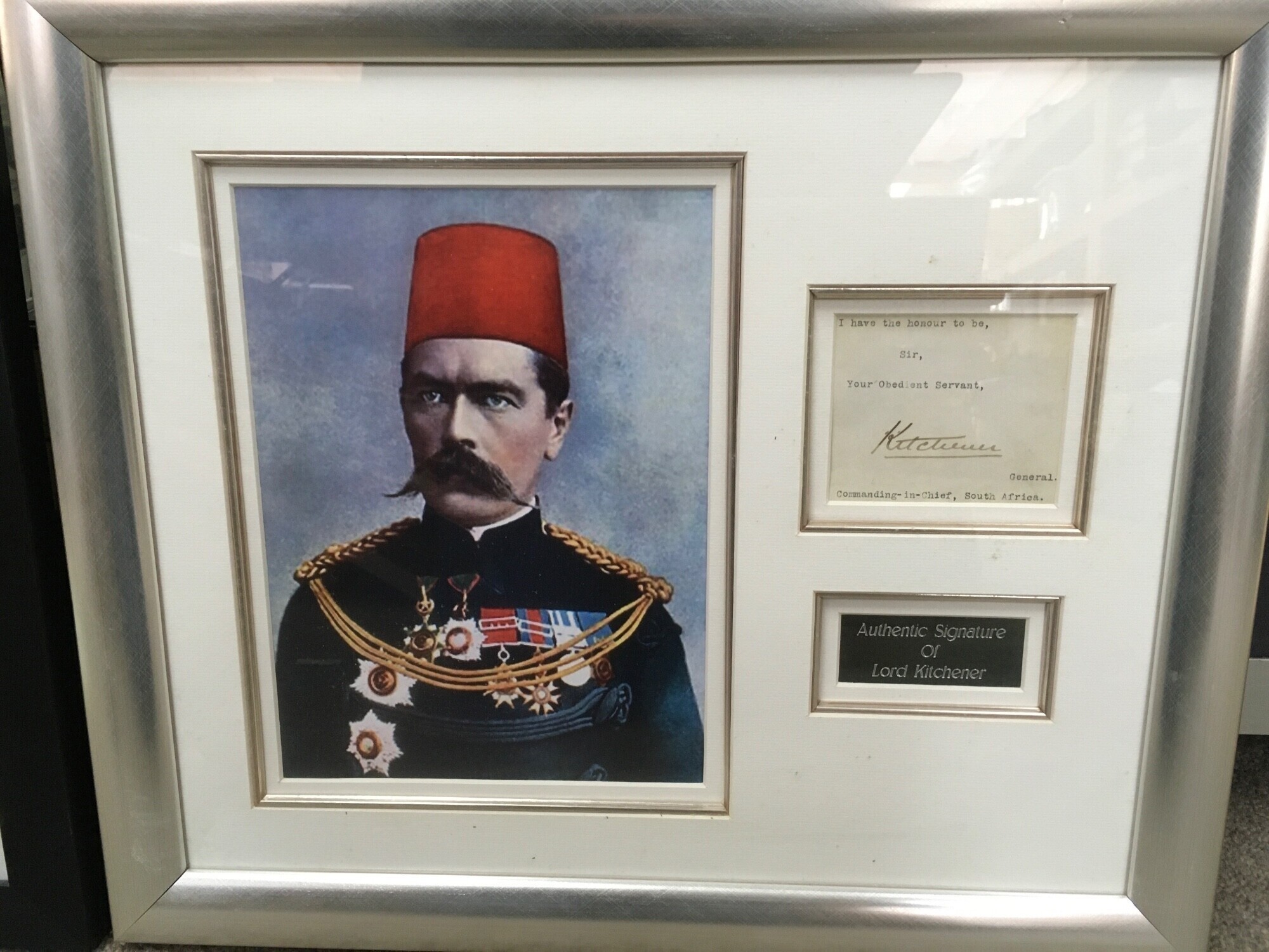 A framed display of the autograph of Lord Kitchener ,frame dimensions 50x43cm