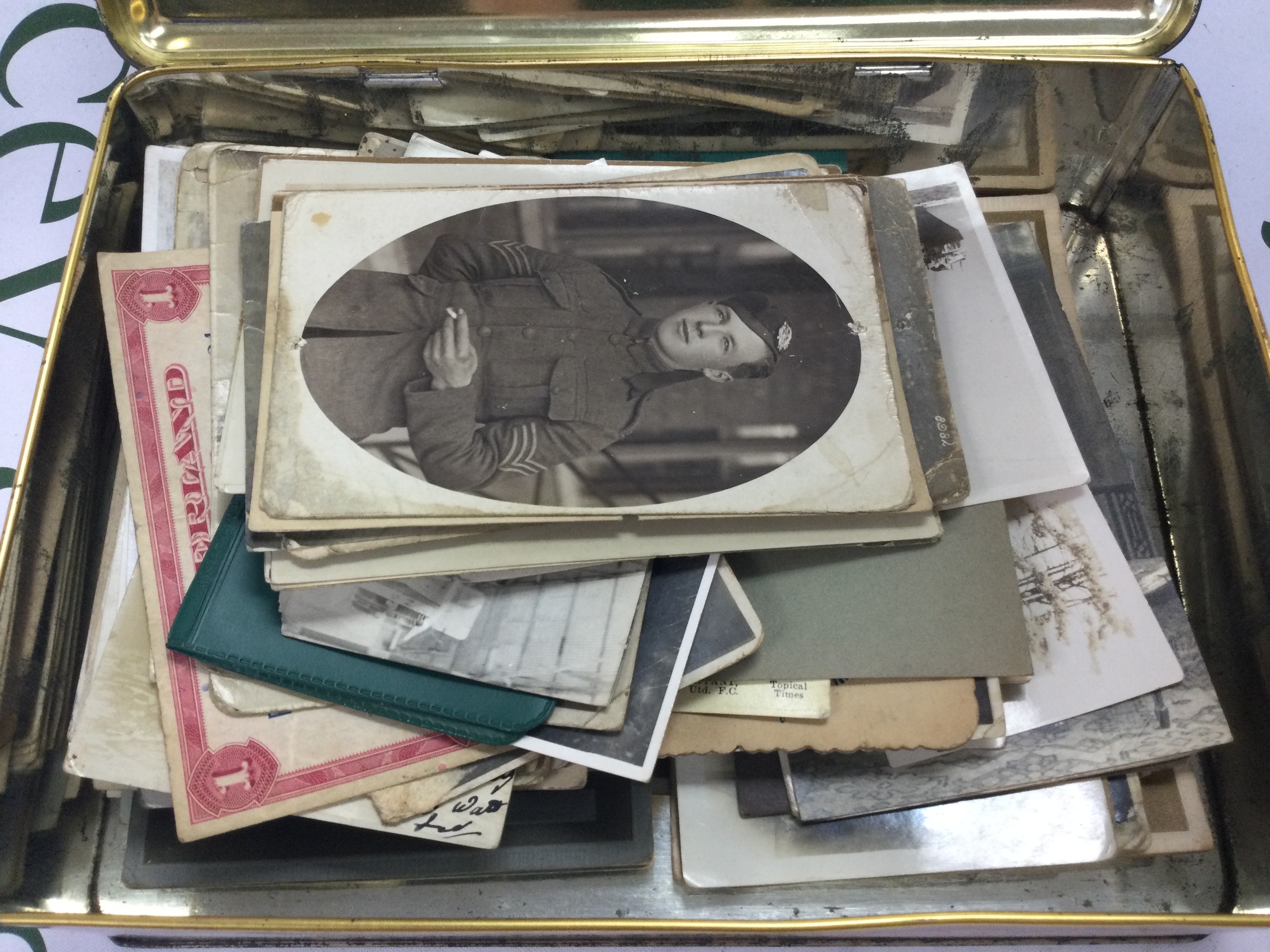 A tin of British military post cards/ photographs and other period photographs circa 1920