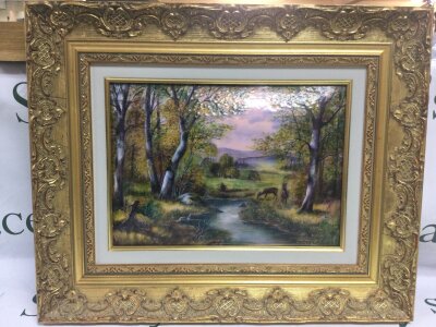 A large Limoges gilt framed enamel plaque of deer in the wild by Pierre Bonnet master enameller at Limoges. Signed P Bonnet .MF Limoges .Frame dimensions 55x45cm