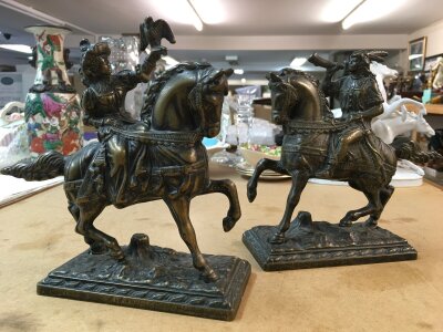 A pair of brass medieval figures on horseback