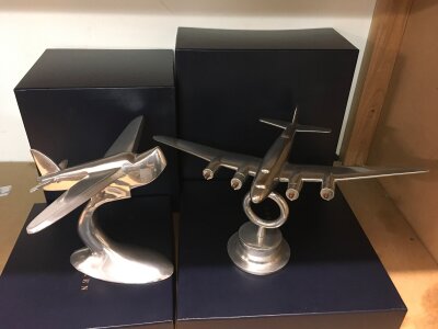A pair of chrome Art Deco style desk weights in the form of aircraft