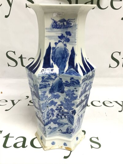 A 19th century Chinese porcelain blue and white vase , the front decorated with a river scene and the back with Chinese text 32cm tall