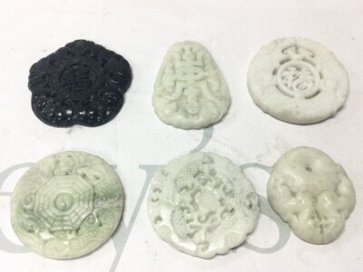 Six jade pendants, 5Cm wide approx. No reserve