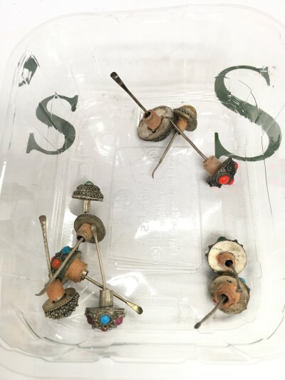 Ten snuff bottle top caps, leaders, covers