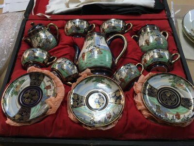 An early 20th Century Japanese Satsuma tea set in a fitted box.