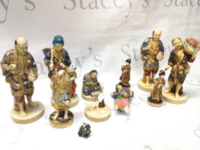 A collection of satusma figures, some damage .