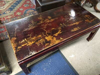 A Chinoiserie lacquered coffee table  38cm tall , 100cm wide