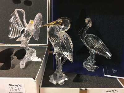 Three boxed Swarovski birds including spoonbill, heron and eagle. No obvious damage or restoration