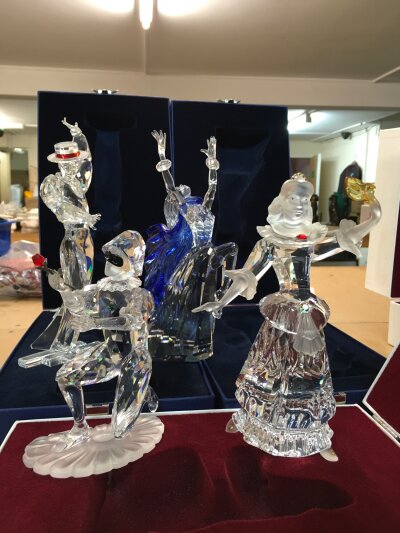 Four boxed Swarovski figures including Pierrot