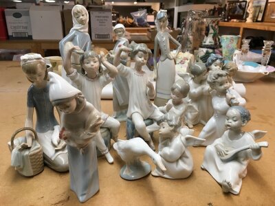 A collection of Lladro pieces including cherubs and maidens with geese. Some A/F