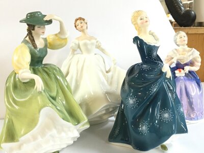 Four royal Doulton lady porcelain figures