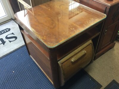 An Art Deco walnut drinks cabinet with record storage, pull out writing desk and glass top. Dimensions 61cm wide 66cm tall- NO RESERVE