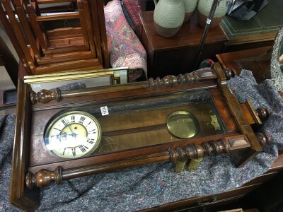 A wall clock with a walnut case, turned columns, brass movement, weights and pendulum. Case 102cm tall , 44cm wide.- NO RESERVE