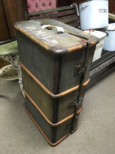 A wooden bound travelling trunk