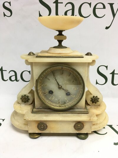 A late 19th century French alabaster clock.